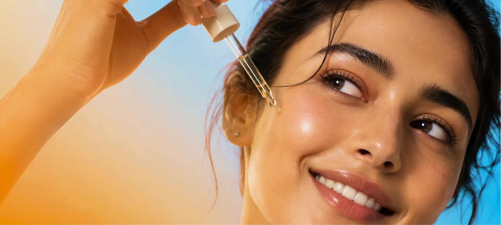 Woman applying a skincare serum with a dropper